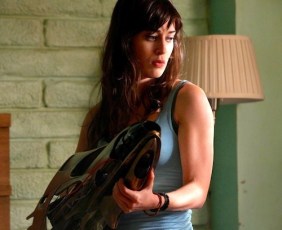 Lizzy Caplan grips the big weapon